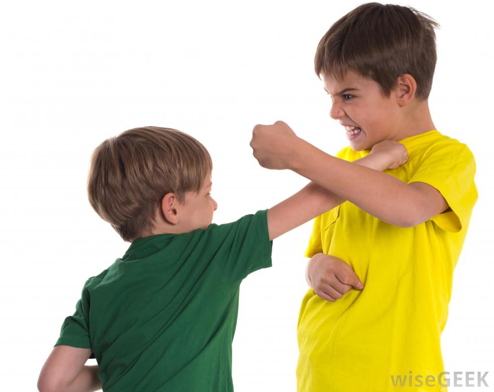 two boys fighting on white